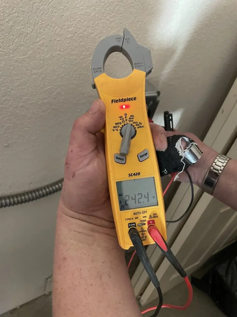 Voltage testing with clamp meter during Outlet Installation in Sweetwater
